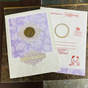 Elegant Purple Lord Ganesha Wedding Invitation Card with a Gold Ganesha Sticker, jumbo size, luxurious design, and royal traditional appeal.
