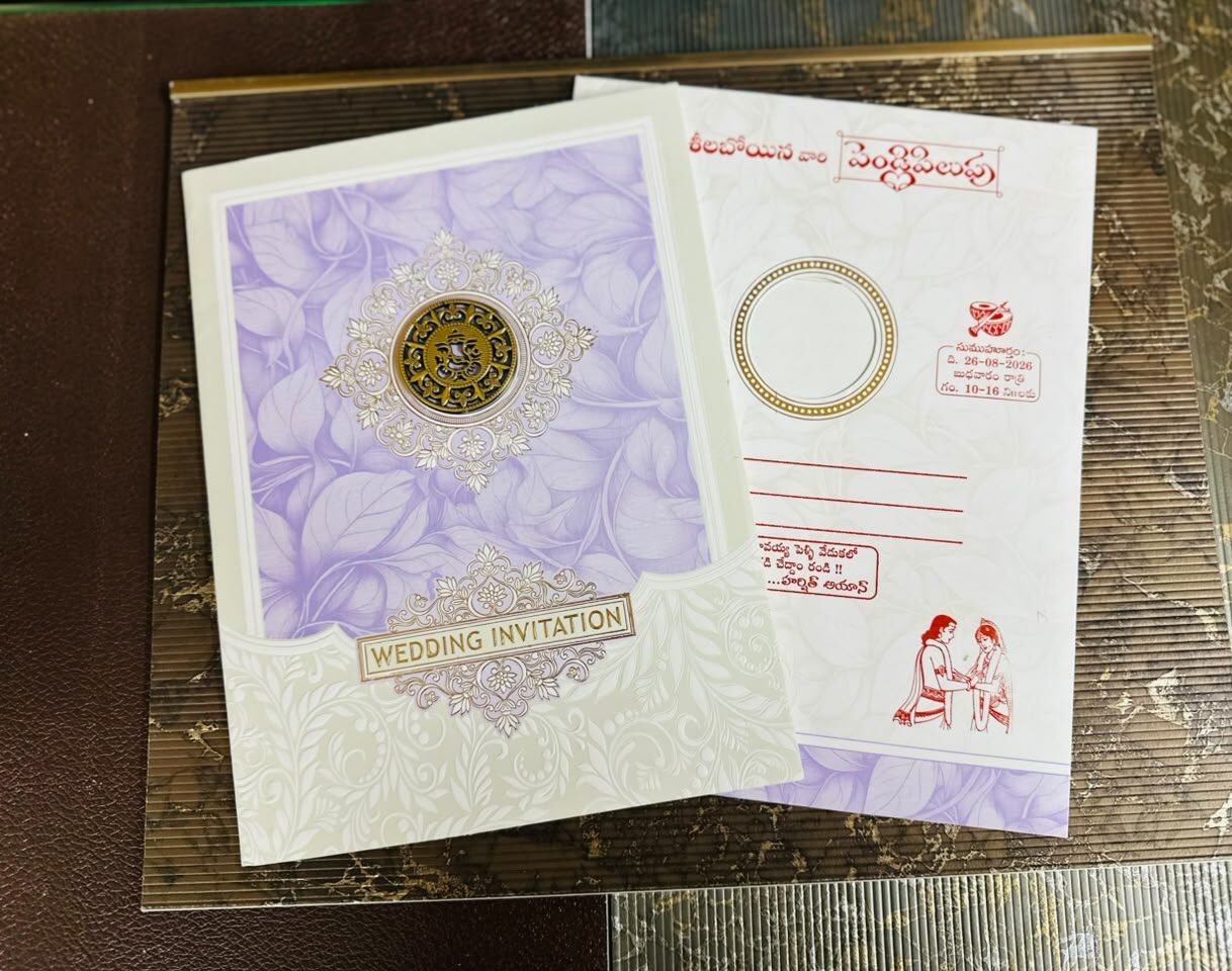 Elegant Purple Lord Ganesha Wedding Invitation Card with a Gold Ganesha Sticker, jumbo size, luxurious design, and royal traditional appeal.